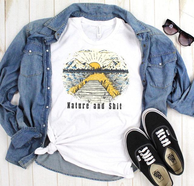 Nature and Shit Sublimation Transfer, T-shirt featuring a scenic lake, mountains, and sunrise design with text