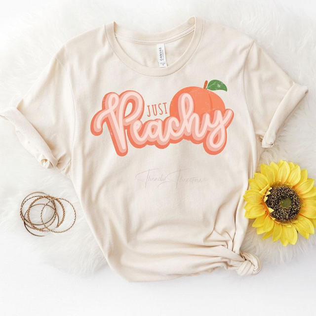 Just Peachy ADULT Screen Print Heat Transfer, peach design on a cream T-shirt with yellow sunflower and bracelets.