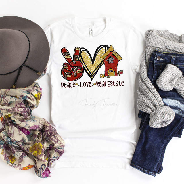 Peace Love Real Estate Sublimation Transfer T-shirt with a design featuring a peace sign, a heart, and a house, surrounded by accessories including a hat, scarf, and jeans