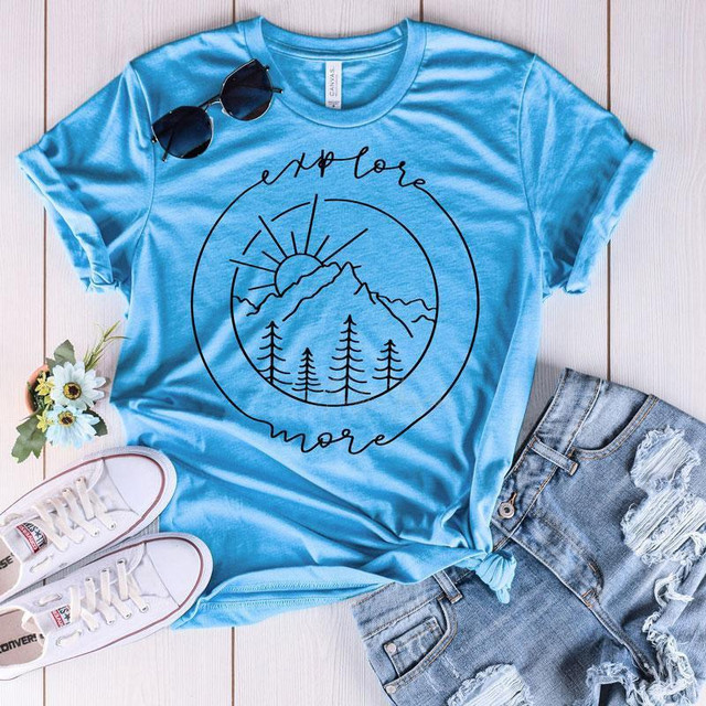 Explore More Screen Print Transfer, blue T-shirt with mountain and sun graphic and the words "explore more" printed on it.