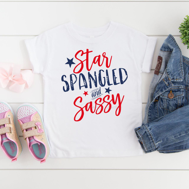 Star spangled and sassy sublimation transfer print on a white T-shirt, featuring patriotic red, navy blue, and white colors with star accents.