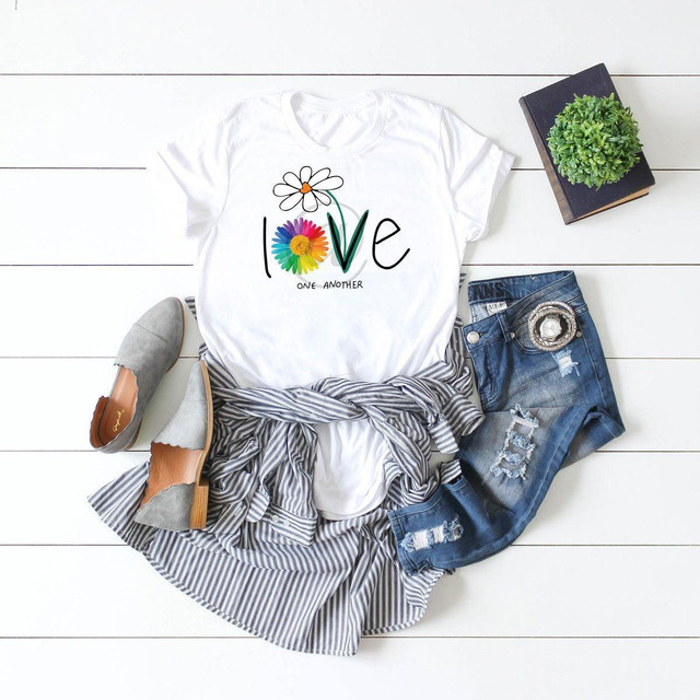 Love One Another Daisy FINAL STOCK Screen Print Heat Transfer - stylish casual outfit flat lay with printed T-shirt, ripped jeans, gray flats, and accessories, displaying the product design.