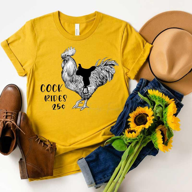 Cock Rides Screen Print Heat Transfer, yellow T-shirt with rooster graphic and riding figure, vintage cowboy boots, straw hat, and sunflower bouquet, casual fashion style