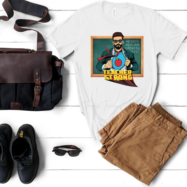 Male Teacher Strong Chalk Board Sublimation Transfer T-shirt with superhero teacher graphic and book background, suitable for education or teaching themed apparel.
