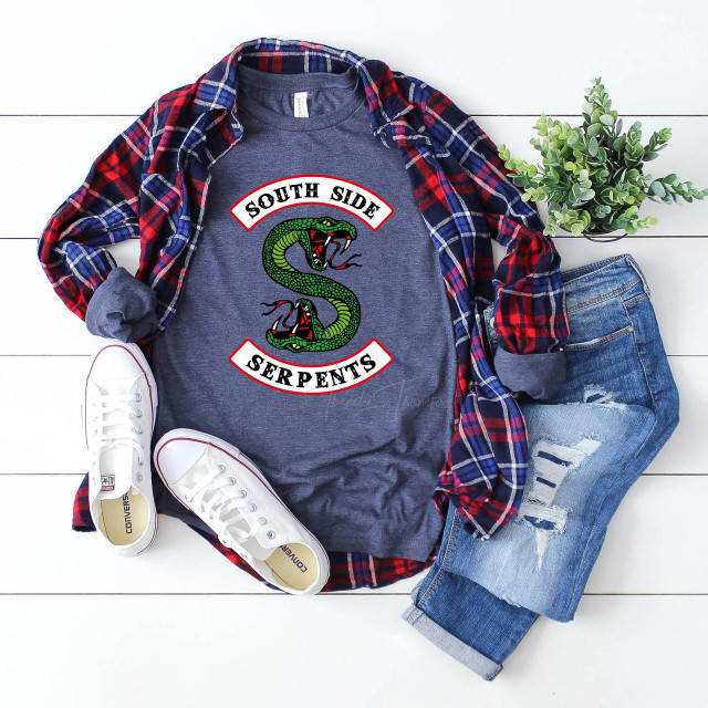 South Side Serpents FINAL STOCK Screen Print Transfer - Graphic T-shirt with a coiled green serpent and bold lettering, casual outfit laid out with jeans, sneakers, a plaid shirt, and a potted plant.