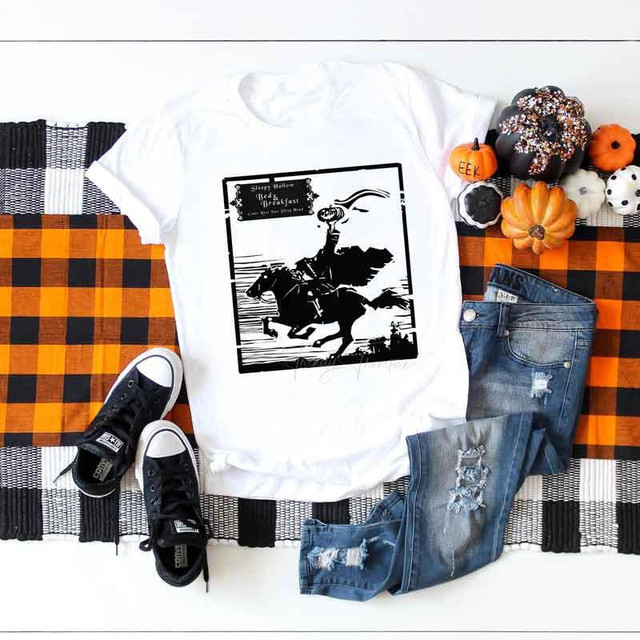 Sleepy Hollow Sublimation Transfer, black and white Halloween-themed illustration of a horse rider with a pumpkin on the shirt.