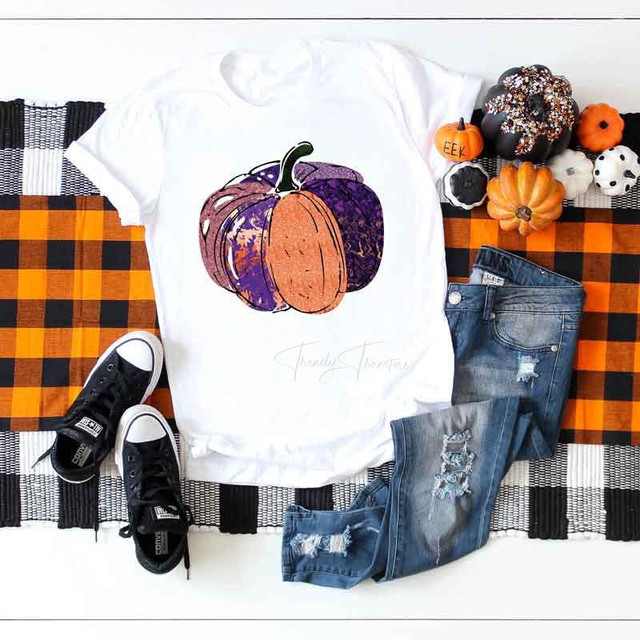 Halloween Pumpkin Sublimation Transfer, design of a colorful pumpkin with purple and orange hues, displayed on a white T-shirt for Halloween decoration.