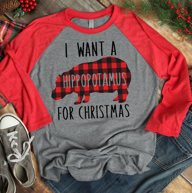 I Want A Hippopotamus For Christmas Screen Print Heat Transfer T-Shirt, gray and red raglan shirt with a hippo silhouette adorned in red and black plaid, holiday-themed design.