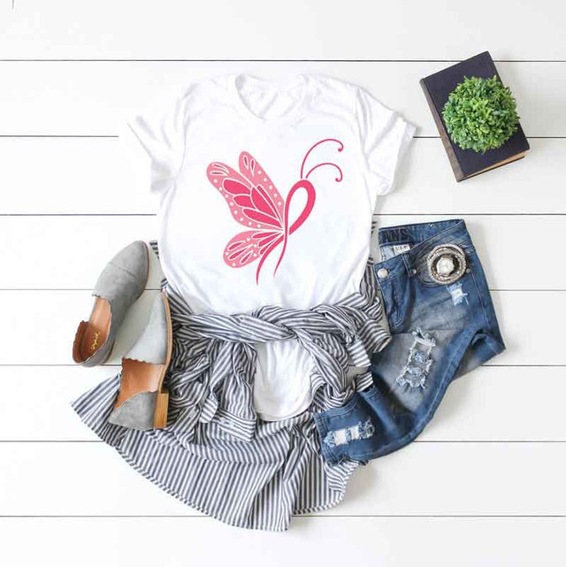 Breast Cancer Awareness Butterfly Sublimation Transfer, pink butterfly design on white T-shirt with casual outfit accessories.