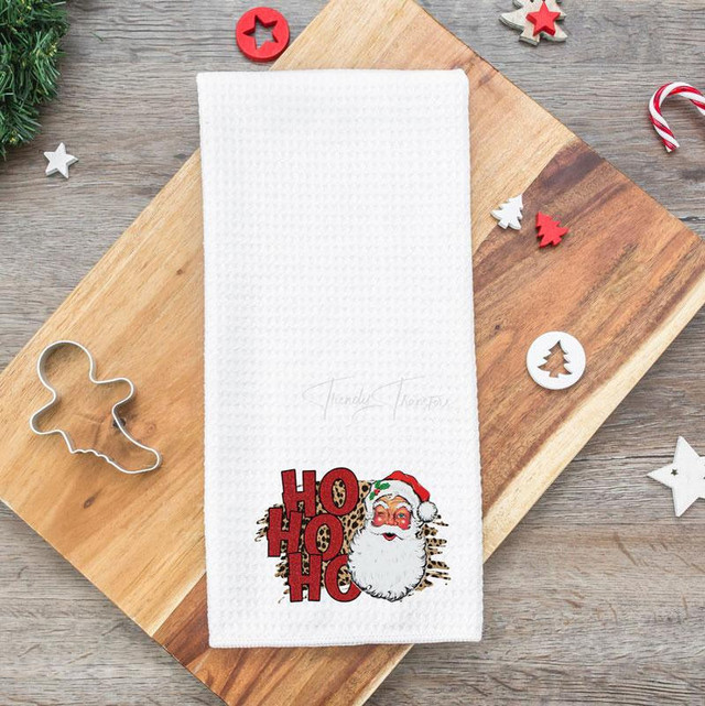 Santa Ho Ho Ho Tea Towel Screen Print Heat Transfers, Christmas themed tea towel featuring a Santa Claus face and festive 'Ho Ho Ho' text design.