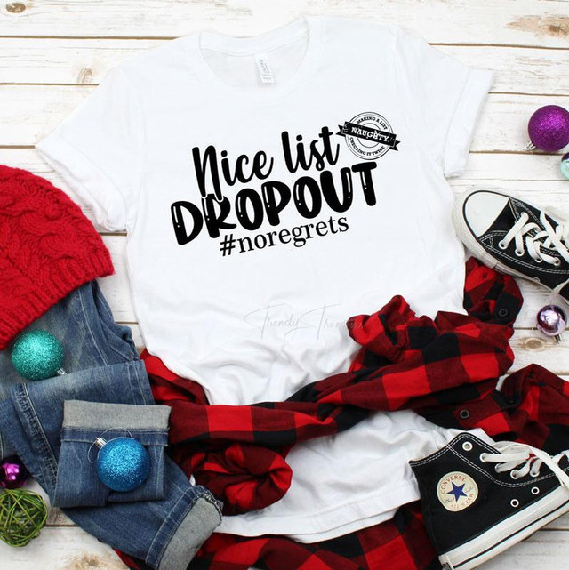 Nice List Drop Out sublimation transfer, white T-shirt with black text and hashtag, surrounded by casual clothing and holiday decorations.