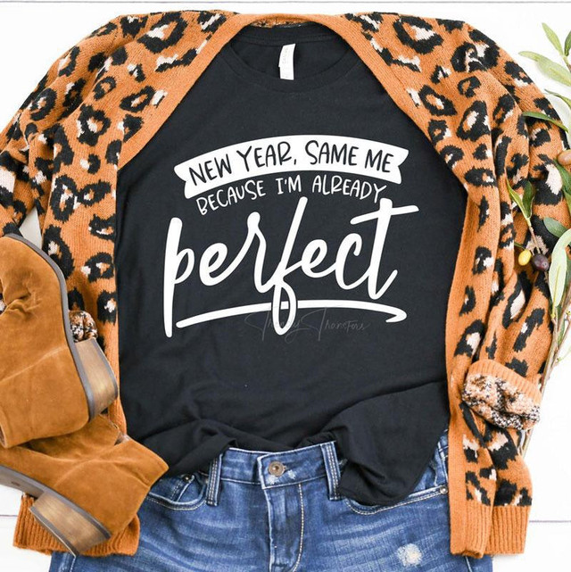 New Year Same Me Screen Print Plastisol Ink Transfer, black t-shirt with white motivational quote and casual outfit including leopard print cardigan, blue jeans, and brown boots.