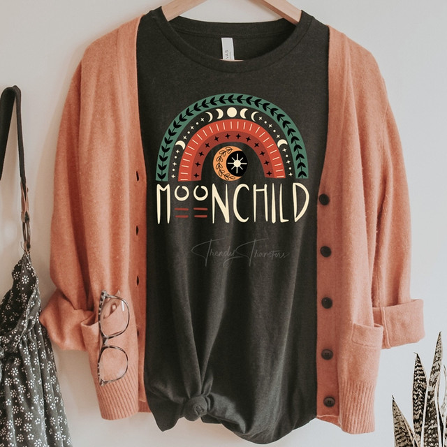 Moonchild Rainbow Screen Print Heat Transfer, black T-shirt with colorful celestial rainbow design and moon symbols.