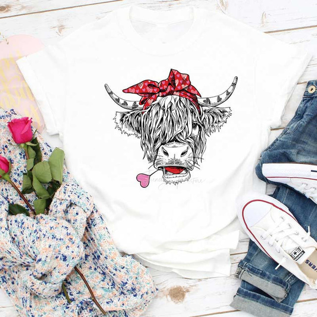 Shaggy Cow Valentines Sublimation Transfer, white T-shirt with a cartoon shaggy cow wearing a red bandana and sticking out its tongue.
