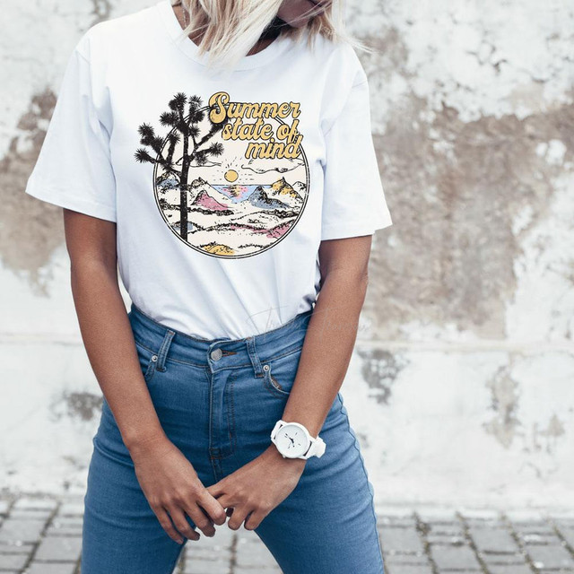 Summer State Of Mind Sublimation Transfer, close-up of a woman wearing a white T-shirt with a colorful mountain landscape and sunset design.
