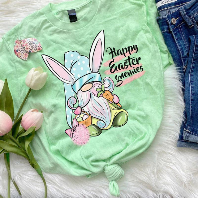Happy Easter Gnomies Screen Print Heat Transfer, pastel green t-shirt featuring a cute Easter gnome with bunny ears and colorful decorations.