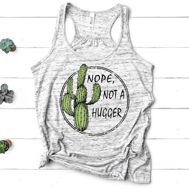 Not A Hugger Cactus Sublimation Transfer, a sleeveless gray and white tank top featuring a cactus illustration with the humorous phrase 'Nope, Not A Huggger' on a white wooden background with small succulents on the side.