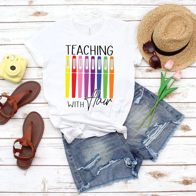 Teaching With Flair Sublimation Transfer, colorful pen design on white T-shirt.