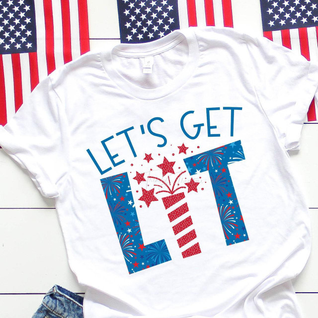 Let's Get Lit Firework Fourth Of July Patriotic Sublimation Transfer, a festive white T-shirt with red, white, and blue fireworks and stars design suited for Independence Day celebrations.