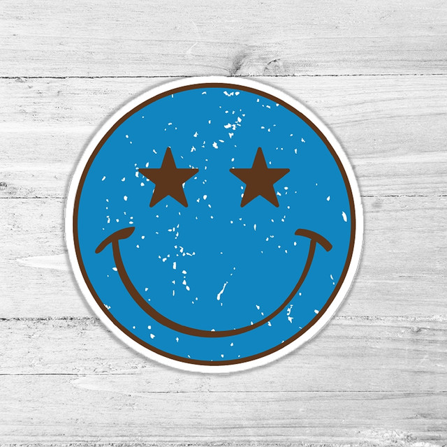 Blue Star Smiley Retro Die Cut Sticker, round blue sticker with a distressed look featuring a smiling face with star-shaped eyes.