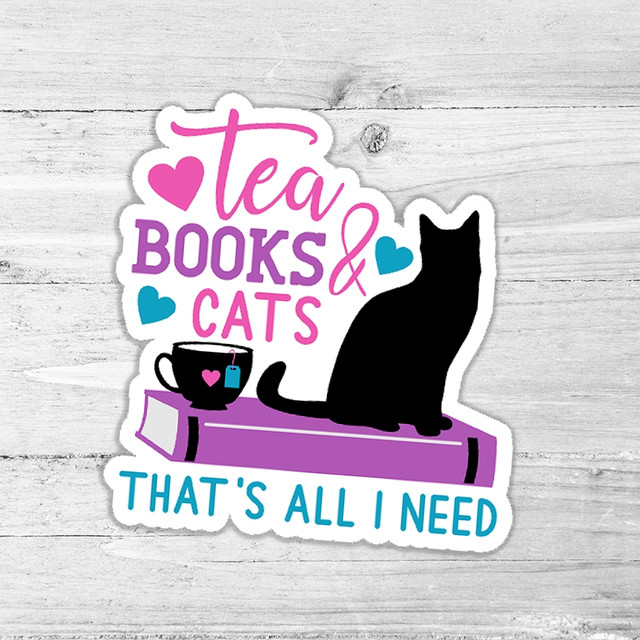 Tea, Books & Cats That's All I Need Die Cut Sticker, featuring a black cat, a coffee mug, books, and colorful hearts on a white wooden background.