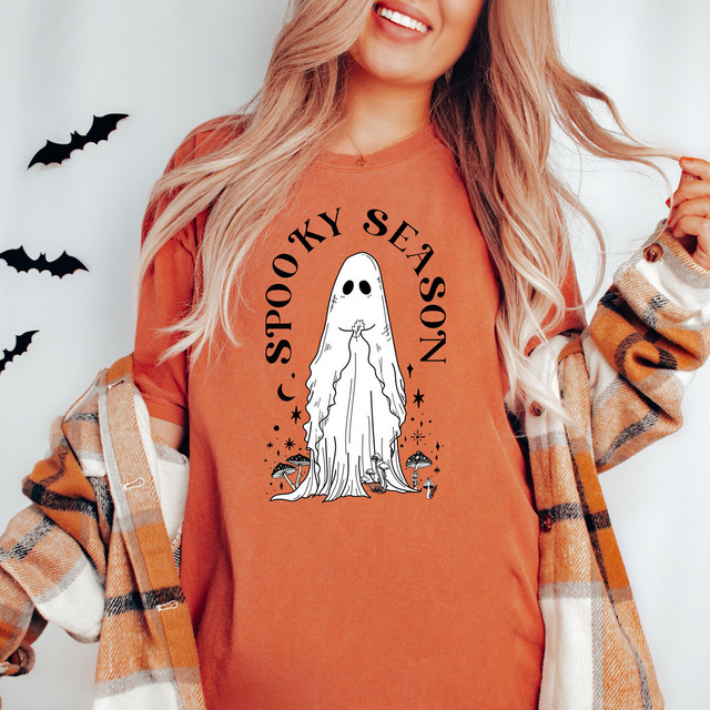 Spooky Season Ghost DTF, Halloween-themed graphic T-shirt with a ghost illustration and spooky design elements.