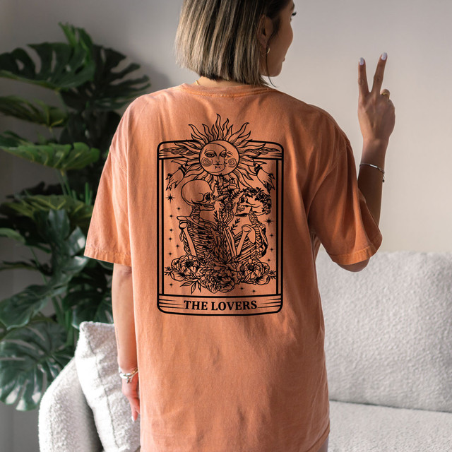 Lovers Skeleton Tarot Card Screen Print Heat Transfer, product shown on a woman's back in a casual setting.