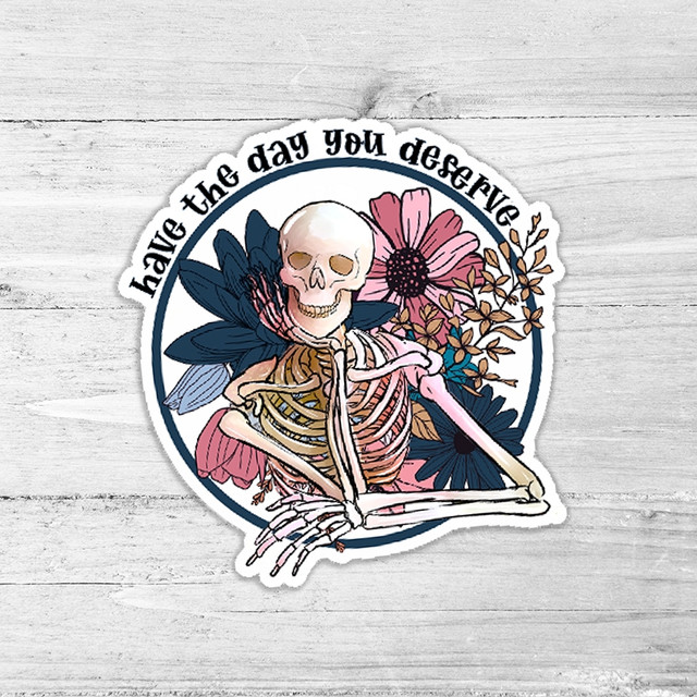 Have The Day You Deserve Die Cut Sticker, skeleton with flowers and the motivational phrase