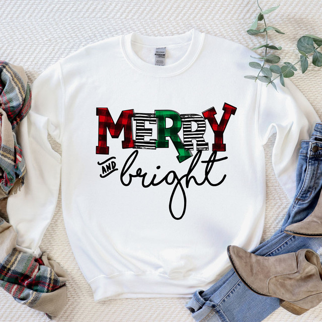 Merry & Bright DTF Transfer, graphic design with colorful holiday-themed MERRY letters and stylish black cursive and print fonts saying and bright on a white sweatshirt.