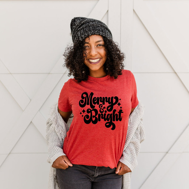 Merry & Bright Retro DTF Transfer, woman wearing a red T-shirt with the festive design 'Merry & Bright' in black ink for holiday decoration.