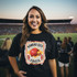 KC Helmet DTF Heat Transfer, a colorful heat transfer patch with the Kansas City Chiefs logo on a woman's black T-shirt at a sports stadium.