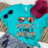 School's Out Forever DTF Heat Transfer, colorful and vibrant summer-themed graphic design on a turquoise T-shirt with sunglasses, cap, and denim shorts.