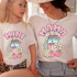 Mama Spring Drinks DTF Heat Transfer, colorful design featuring a mason jar with straws, strawberries, daisies, and sparkles on white T-shirts worn by a woman and a girl.