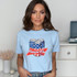 Ameri Can DTF Heat Transfer, a design featuring three soda cans decorated with American flag patterns on a woman's t-shirt.