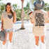 Let Them DTF Heat Transfer, woman wearing a white T-shirt with black text design on front and back in a sunny outdoor setting with palm trees.