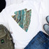 Turquoise Arrowhead Sublimation Transfer, vibrant turquoise and earth tone marble pattern in arrowhead shape on a white t-shirt.