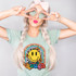 You're More Than Enough DTF Heat Transfer, colorful graphic with a smiley face and positive words, on a woman's T-shirt, showcasing creative heat transfer design.