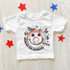 America The Beautiful Retro DTF Heat Transfer, white children's t-shirt with a tie-dye smiley face design surrounded by butterflies and stars.