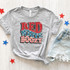 Red White Boozy DTF Heat Transfer, graphic t-shirt with patriotic American flag style design in red, white, and blue colors.