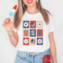 USA Retro DTF Heat Transfer, colorful graphic design featuring American flag motifs, flowers, and bold letters on a white t-shirt.