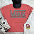 Checkered Mama DTF Heat Transfer, black and white checkered design with the word 'MAMA' on a pink t-shirt.