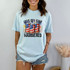 Let's Get Star Spangled Hammered DTF Heat Transfer, colorful patriotic design with cans decorated with American flag pattern, fireworks in the background.