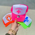 Lifeguard Pink DTF Heat Transfer, colorful caps with lifeguard symbol and text in pink, orange, blue, and green colors.