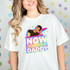 Now That's What I Call Daddy DTF Heat Transfer T-shirt design featuring a young woman with a colorful, vibrant graphic of a man with text on a white t-shirt.