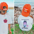 Back To School Apple DTF Heat Transfer, girl wearing orange cap with colorful text and a white T-shirt with a graphic of a character with a backpack and text.