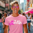 I Am Kenough Version 2 DTF Heat Transfer, pink T-shirt with white and pink text, casual fashion style on a smiling man in an outdoor urban setting.