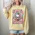 Try That In A Small Town Guitar Pink DTF Heat Transfer, a vibrant pink graphic with a skull, wings, guitars, and bold text on a yellow sweatshirt