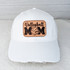 Volleyball Mom Leather Hat Patch, white baseball cap with a leather patch featuring the text 'Volleyball MOM' with a volleyball and heart design.