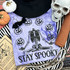 Stay Spooky Black PUFF Screen Print Heat Transfer, spooky design featuring a skeleton, pumpkins, and the text 'Stay Spooky' on purple fabric.