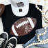 Sequins Football Patch Chenille Patch, a sparkling football-shaped sequin and chenille patch with white and brown colors, displayed on a flat lay with casual fashion accessories.